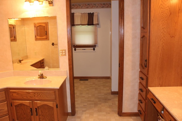 28 Manorhill Dr, Clinton, IL 61727 - bathroom featuring vanity and baseboards