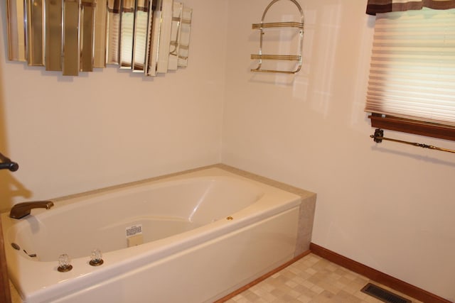 28 Manorhill Dr, Clinton, IL 61727 - full bath featuring a garden tub and tile patterned floors