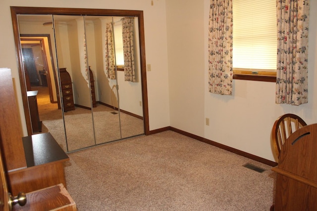 28 Manorhill Dr, Clinton, IL 61727 - carpeted bedroom with a closet and baseboards