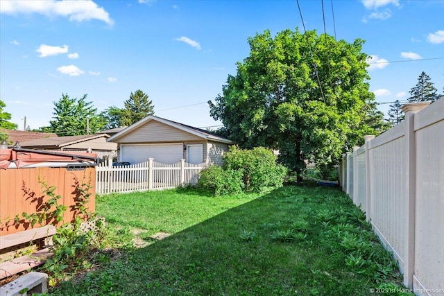 659 W Albert St, Elmhurst, IL 60126 - fenced backyard with a garage and an outbuilding