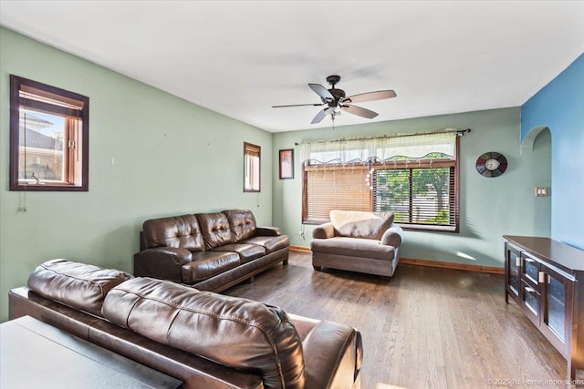 659 W Albert St, Elmhurst, IL 60126 - living room featuring arched walkways, wood finished floors, and ceiling fan