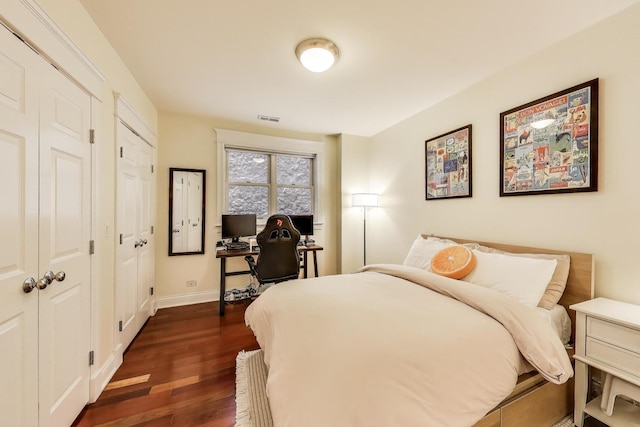 846 W Roscoe St Unit 3W, Chicago, IL 60657 - bedroom with dark wood-type flooring, an office area, and multiple closets