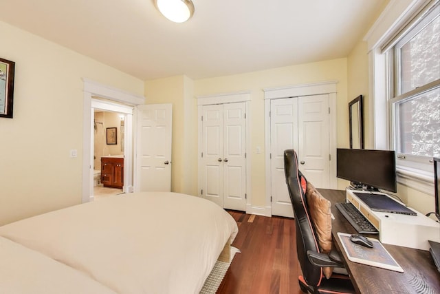 846 W Roscoe St Unit 3W, Chicago, IL 60657 - bedroom with multiple closets, dark wood-style floors, and an office area