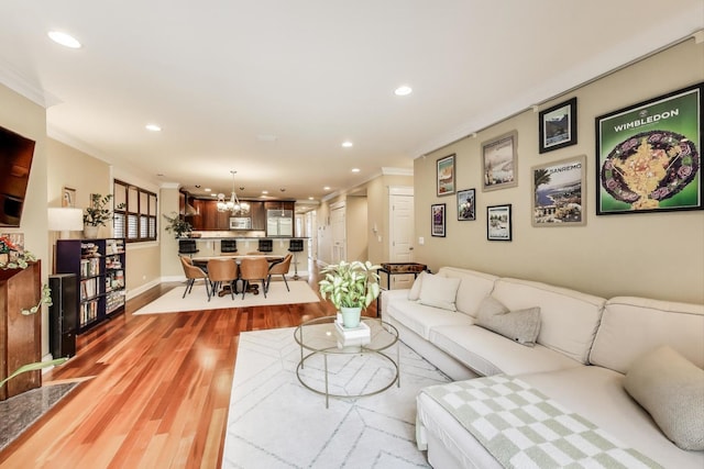 846 W Roscoe St Unit 3W, Chicago, IL 60657 - living area featuring crown molding, recessed lighting, light wood-type flooring, and a chandelier