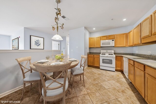 965 Rogers St Unit 202, Downers Grove, IL 60515 - kitchen featuring white appliances, pendant lighting, recessed lighting, stone countertops, and light tile patterned floors