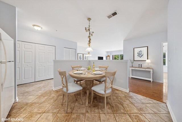 965 Rogers St Unit 202, Downers Grove, IL 60515 - dining area featuring light tile patterned flooring and baseboards