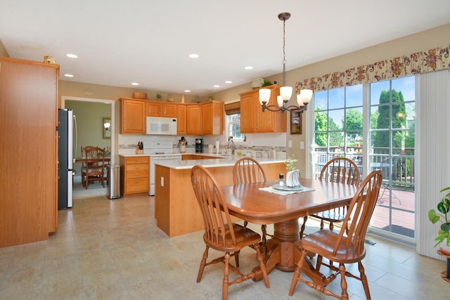 3115 Sable Oaks Rd, Bloomington, IL 61704 - dining area with a chandelier and recessed lighting