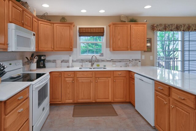 3115 Sable Oaks Rd, Bloomington, IL 61704 - kitchen featuring white appliances, decorative backsplash, light countertops, recessed lighting, and light tile patterned floors
