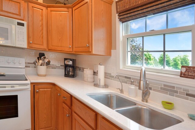 3115 Sable Oaks Rd, Bloomington, IL 61704 - kitchen with white appliances, light countertops, and tasteful backsplash
