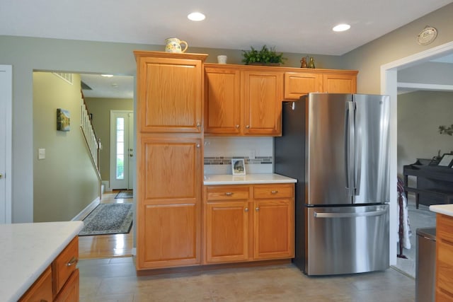 3115 Sable Oaks Rd, Bloomington, IL 61704 - kitchen featuring freestanding refrigerator, light countertops, recessed lighting, and brown cabinets