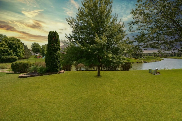 3115 Sable Oaks Rd, Bloomington, IL 61704 - yard at dusk with a water view and a yard