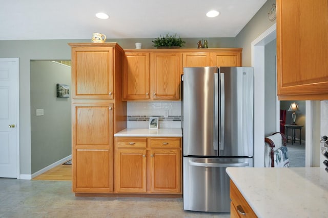 3115 Sable Oaks Rd, Bloomington, IL 61704 - kitchen featuring freestanding refrigerator, decorative backsplash, and recessed lighting