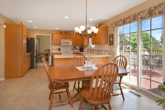 3115 Sable Oaks Rd, Bloomington, IL 61704 - dining room featuring a chandelier and recessed lighting