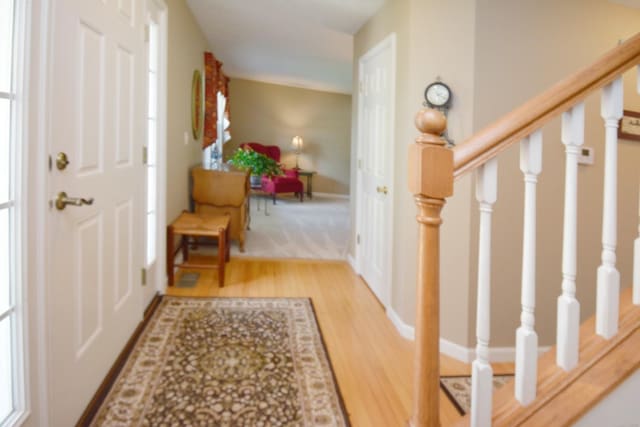 3115 Sable Oaks Rd, Bloomington, IL 61704 - foyer featuring wood finished floors and stairs