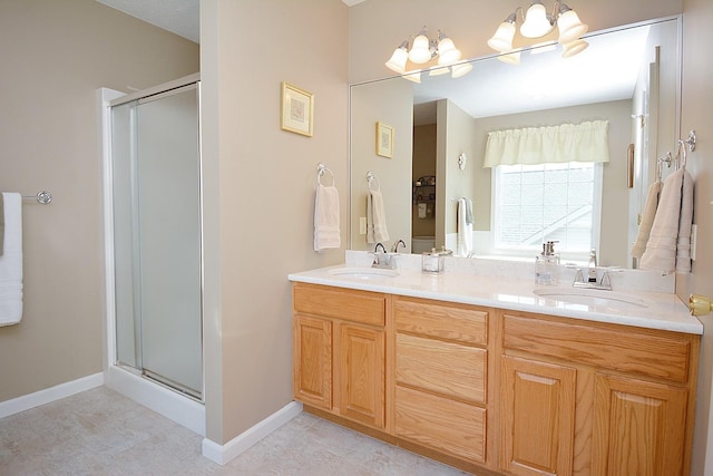 3115 Sable Oaks Rd, Bloomington, IL 61704 - full bathroom featuring a stall shower, double vanity, and a chandelier