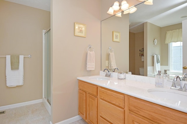 3115 Sable Oaks Rd, Bloomington, IL 61704 - full bathroom with double vanity, a shower with shower door, and a chandelier