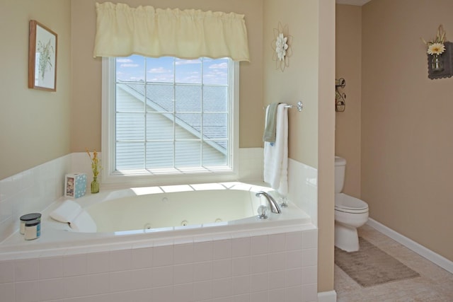 3115 Sable Oaks Rd, Bloomington, IL 61704 - bathroom with a tub with jets, plenty of natural light, and tile patterned flooring