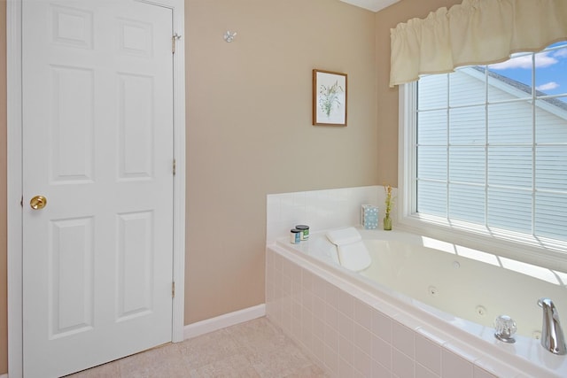 3115 Sable Oaks Rd, Bloomington, IL 61704 - bathroom featuring a jetted tub, healthy amount of natural light, and tile patterned floors