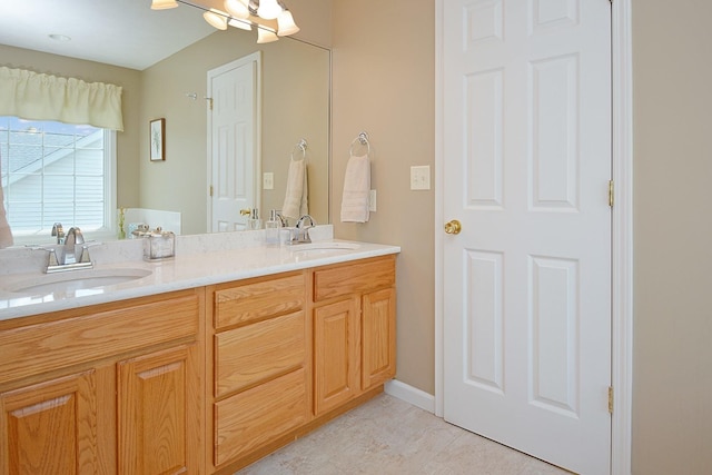 3115 Sable Oaks Rd, Bloomington, IL 61704 - bathroom featuring double vanity and tile patterned flooring