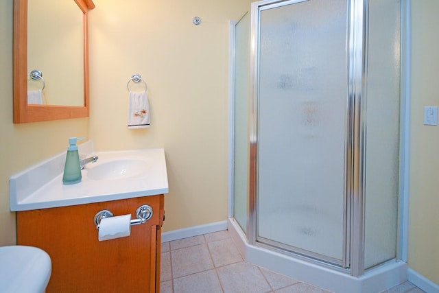 3115 Sable Oaks Rd, Bloomington, IL 61704 - bathroom with vanity, a stall shower, and tile patterned flooring