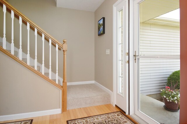 3115 Sable Oaks Rd, Bloomington, IL 61704 - foyer featuring wood-type flooring, stairway, and plenty of natural light