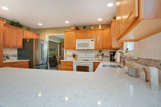 3115 Sable Oaks Rd, Bloomington, IL 61704 - kitchen featuring white appliances, recessed lighting, decorative backsplash, and light stone countertops