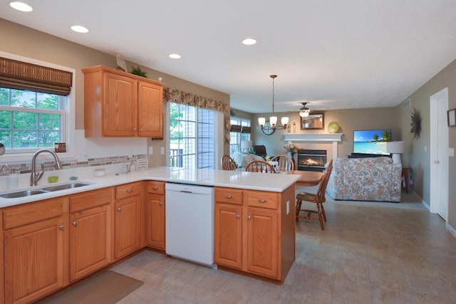 3115 Sable Oaks Rd, Bloomington, IL 61704 - kitchen with white dishwasher, plenty of natural light, a peninsula, light countertops, and recessed lighting