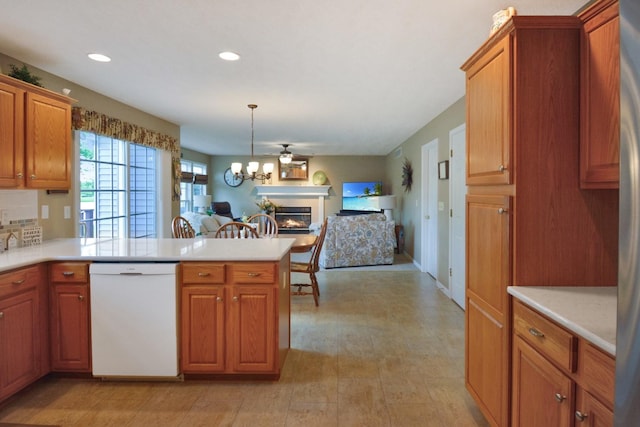 3115 Sable Oaks Rd, Bloomington, IL 61704 - kitchen with dishwasher, light countertops, a peninsula, open floor plan, and brown cabinets
