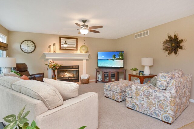 3115 Sable Oaks Rd, Bloomington, IL 61704 - living room with carpet floors, a fireplace, and a ceiling fan