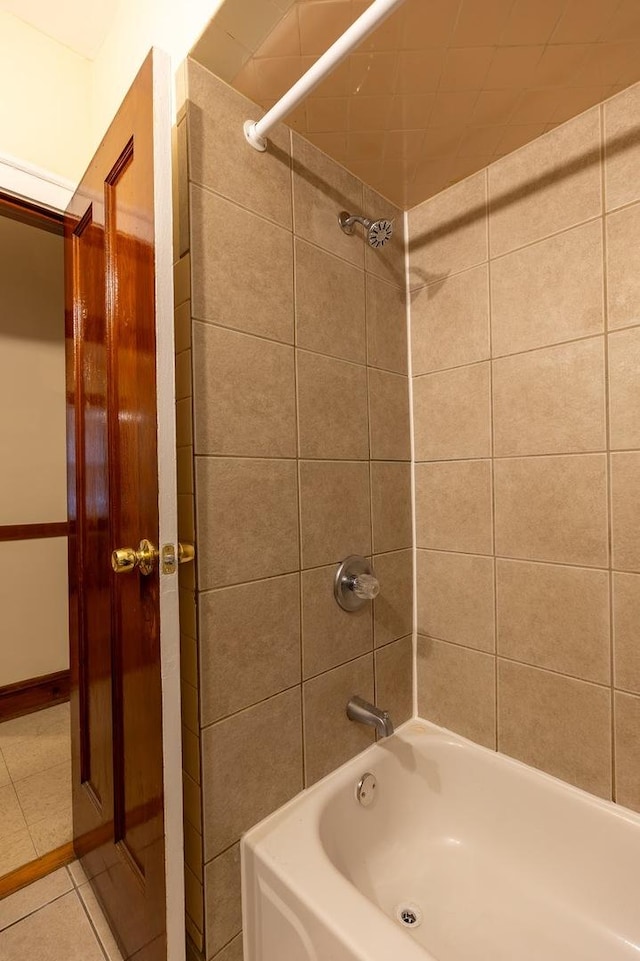 bathroom featuring shower / washtub combination and tile patterned flooring