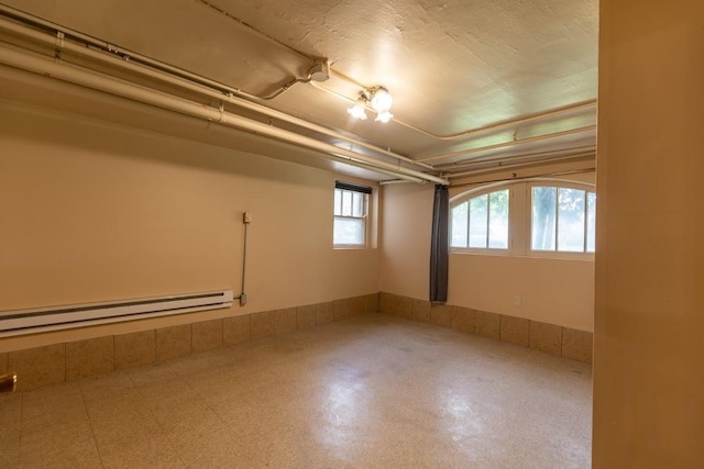 below grade area with a baseboard radiator