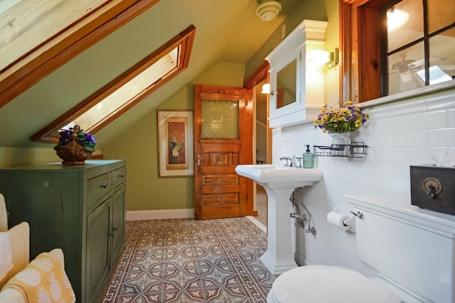 9 Harwood Pl, Bloomington, IL 61701 - bathroom featuring vaulted ceiling, a skylight, and tile patterned floors