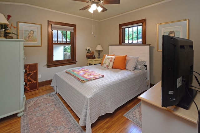 9 Harwood Pl, Bloomington, IL 61701 - bedroom with light wood finished floors, multiple windows, ornamental molding, and a ceiling fan