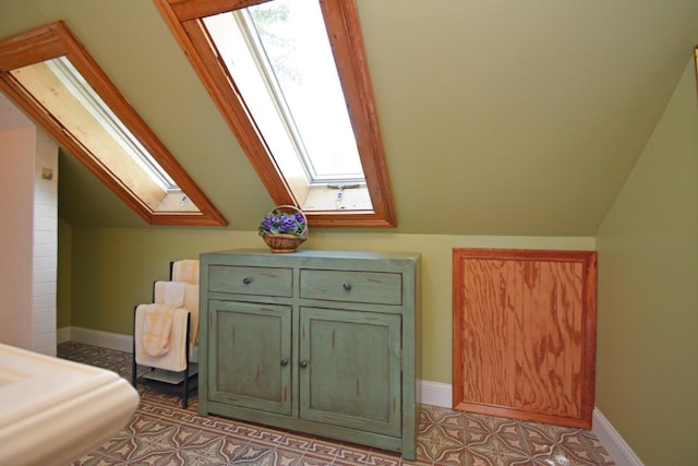 9 Harwood Pl, Bloomington, IL 61701 - bedroom featuring a skylight and lofted ceiling