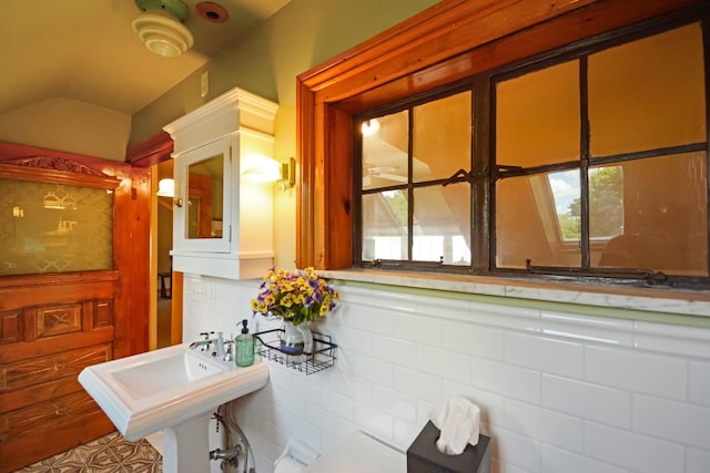 9 Harwood Pl, Bloomington, IL 61701 - bathroom with tasteful backsplash, vaulted ceiling, and healthy amount of natural light