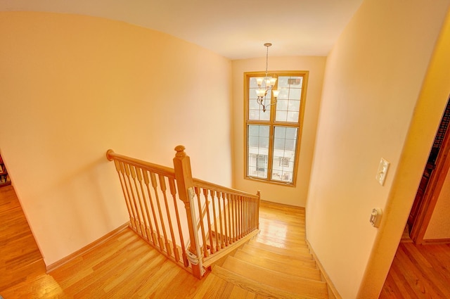 4914 W 82nd St, Burbank, IL 60459 - stairs featuring a chandelier and wood finished floors