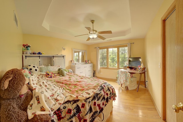 4914 W 82nd St, Burbank, IL 60459 - bedroom with a tray ceiling, light wood-type flooring, and ceiling fan