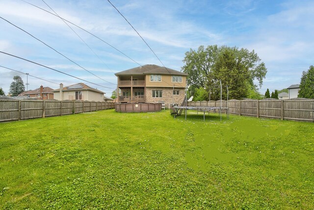 4914 W 82nd St, Burbank, IL 60459 - fenced backyard with a trampoline