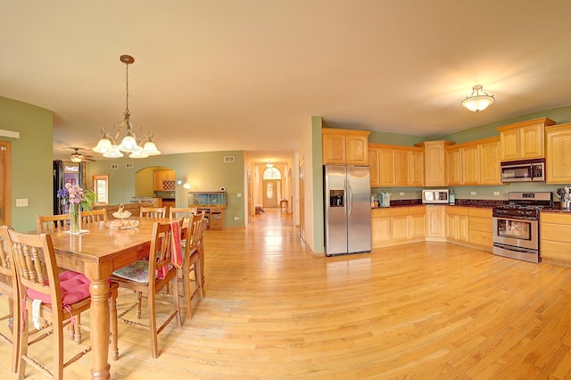 4914 W 82nd St, Burbank, IL 60459 - kitchen with appliances with stainless steel finishes, light brown cabinets, dark countertops, and light wood-style flooring