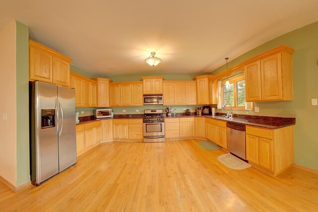 4914 W 82nd St, Burbank, IL 60459 - kitchen with stainless steel appliances, light brown cabinets, light wood-type flooring, and pendant lighting