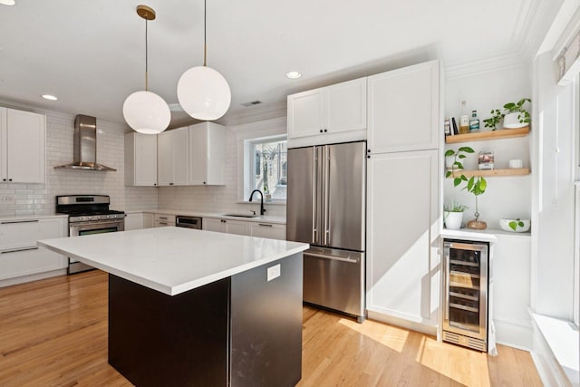 2118 W Schiller St Unit Ch, Chicago, IL 60622 - kitchen featuring wine cooler, appliances with stainless steel finishes, wall chimney range hood, white cabinetry, and recessed lighting