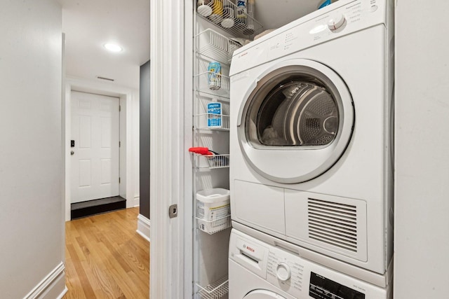 2118 W Schiller St Unit Ch, Chicago, IL 60622 - laundry room featuring stacked washer / drying machine and wood finished floors