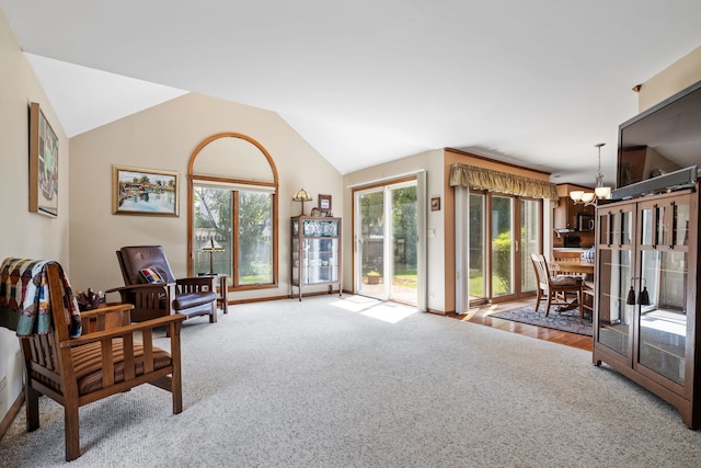 1304 Sheffield Ct, Carol Stream, IL 60188 - sitting room featuring a chandelier, carpet flooring, and lofted ceiling