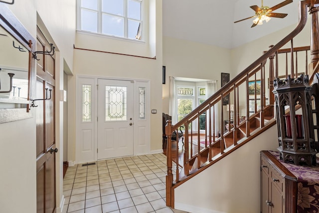 1304 Sheffield Ct, Carol Stream, IL 60188 - entryway with a high ceiling, stairs, ceiling fan, and light tile patterned floors