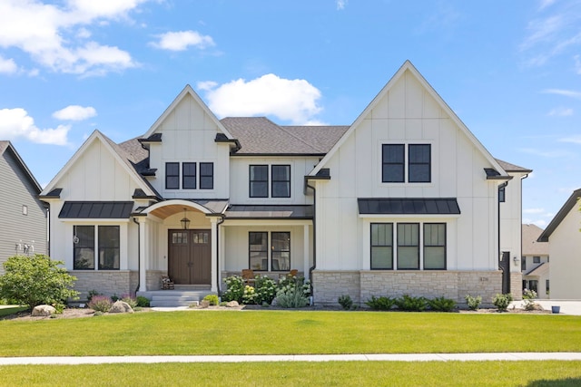 4216 Carpenter Rd, Naperville, IL 60564 - modern inspired farmhouse featuring a standing seam roof, stone siding, and board and batten siding
