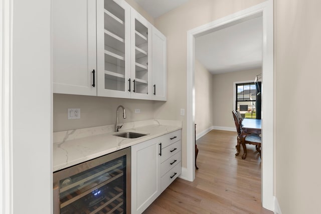 4216 Carpenter Rd, Naperville, IL 60564 - indoor wet bar with beverage cooler and light wood-style floors