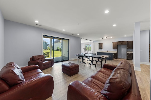 4216 Carpenter Rd, Naperville, IL 60564 - living area with recessed lighting and light wood-style floors