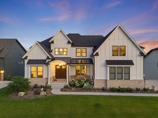 4216 Carpenter Rd, Naperville, IL 60564 - modern inspired farmhouse featuring a standing seam roof, stone siding, and board and batten siding