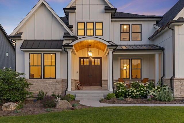 4216 Carpenter Rd, Naperville, IL 60564 - modern farmhouse with a standing seam roof, stone siding, board and batten siding, and a shingled roof