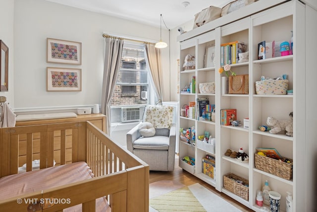 5245 N Winthrop Ave Unit 3S, Chicago, IL 60640 - bedroom with a nursery area and wood finished floors